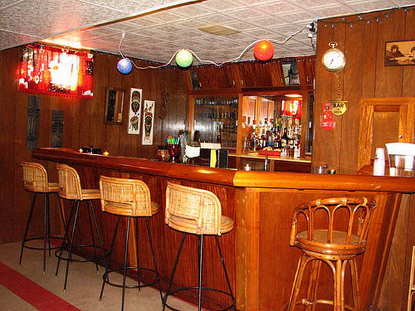 Wooden Basement Bar. It is created with wood taken from a destroyer ship called the Vance. The previous owner did an amazing job of constructing this bar with teak from the ship throughout. 