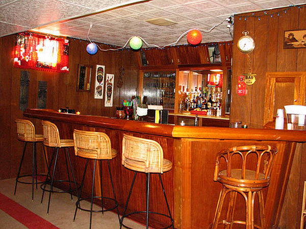 Wooden Basement Bar. It is created with wood taken from a destroyer ship called the Vance. The previous owner did an amazing job of constructing this bar with teak from the ship throughout.