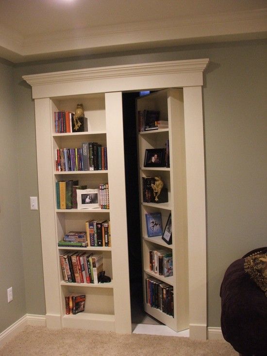 Secret Bookcase Door. Fun and mysterious idea for the basement, with the book shelf/hidden door for extra storage for kids stuff. 