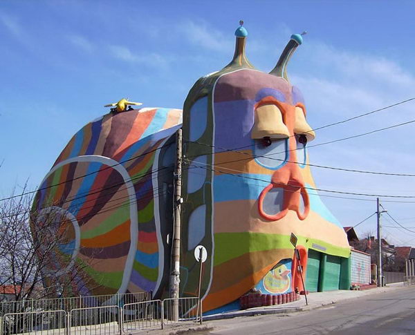 Snail House (Sofia, Bulgaria). The snail house was built with high quality of lightweight and environmentally friendly materials in 2008. The house fits well with the neighboring constructions and producing the illusion that the gigantic snail crawl along the lane. producing the illusion that the gigantic snail crawl along the lane. 