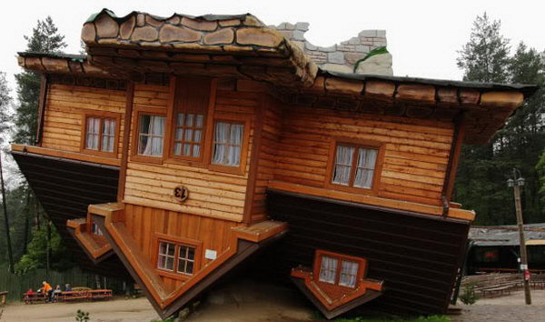 Upside Down House (Szymbark, Poland). A famous vacation spot with many guests entering the model village.