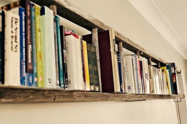 Hamg a ladder horizontally on the wall as a book shelf. 