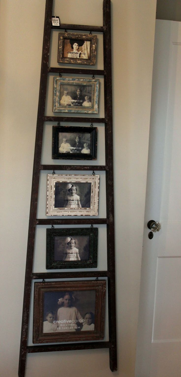 Ladder picture display  Just hang hooks under each step and attach photo. 
