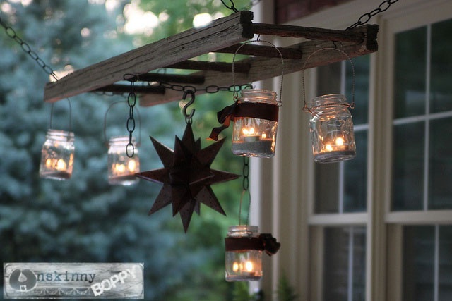 Hang mason jar lights on ladder as a cute vintage lantern hanger. 