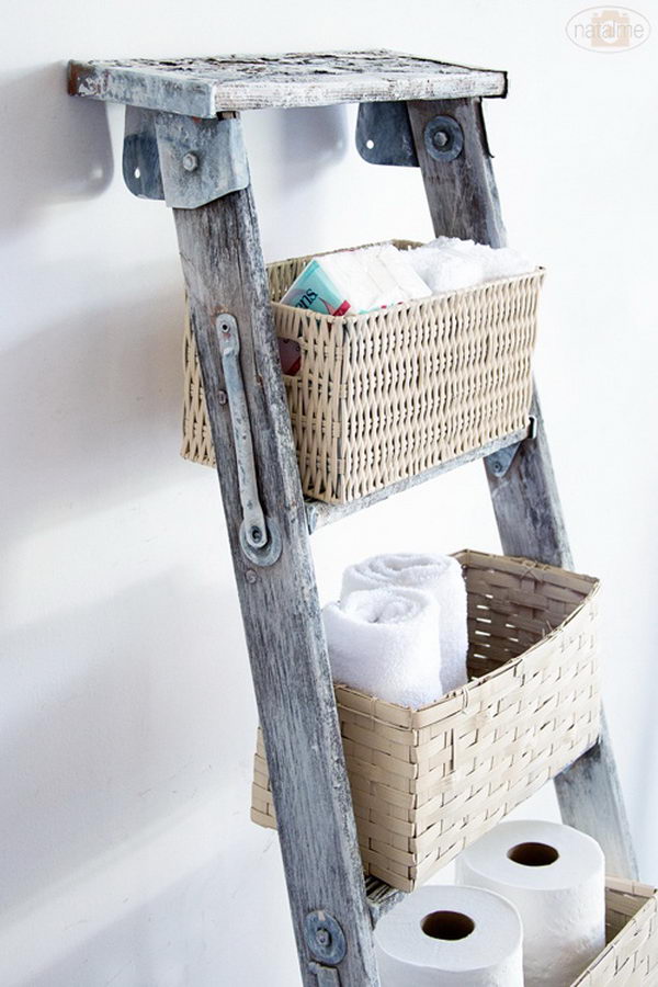 DIY basket ladder storage: Make use of vertical space and add baskets to on old ladder. 