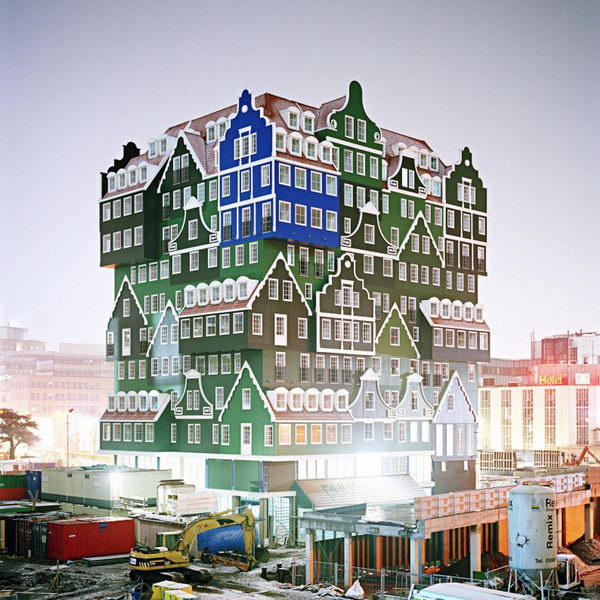 Stacked Houses: New Hotel in Amsterdam. This is a hotel that looks like a pileup of traditional Dutch houses, all grafted together in bright green and blue. The structure is a lively stacking of various examples of these traditional houses, ranging from a notary's residence to a worker's cottage. 