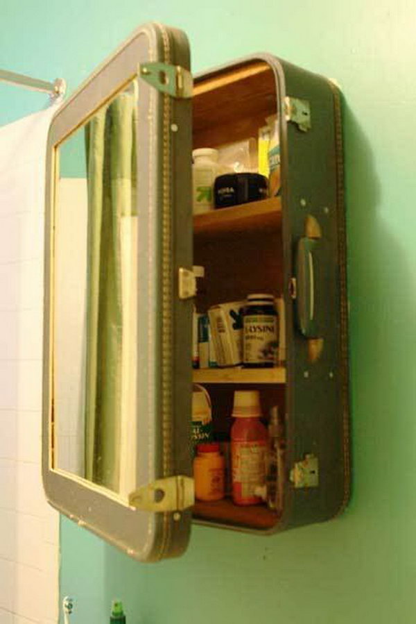 Upcycling an old suitcase into a medicine cabinet. Blake cut the front out of the suitcase and inserted a mirror and then created shelves and reinforced the inside with salvaged wood. 