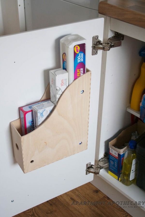 Putting a magazine holder to the inside of kitchen cupboards adds extra space to store more bulky items like chopping boards, cleaning products etc. 