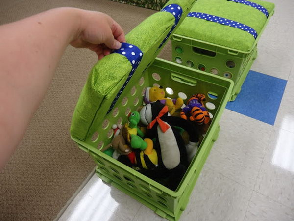 What a clever toy storage idea using recycled milk crates. Cut a piece of wood to fit the inside lip of the crate. Use some padding from the walmart craft section for cushioning and stapled fabric over the seat. 