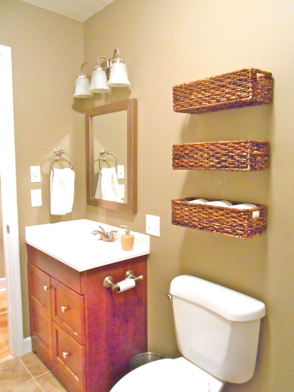 Use the baskets over the toilet to store band aids, extra toilet paper and other first aid stuff. These baskets are not only lovely, but also functional. 