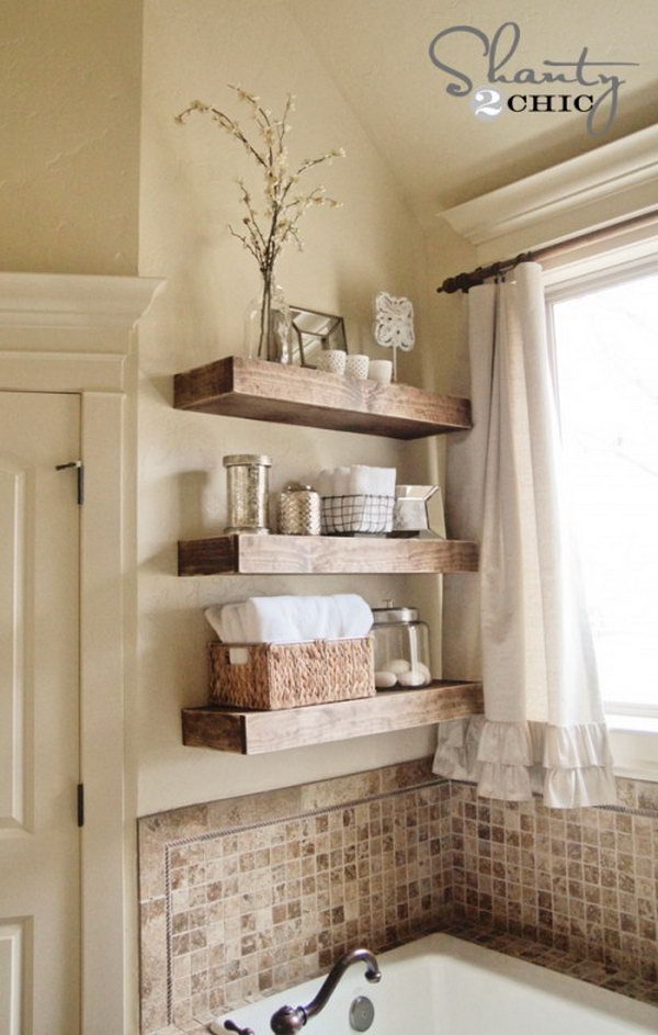 DIY Floating Shelves Above Bathtub. Organize your bath stuff with these DIY rustic floating shelves. They are chic, sleek, and much easier to DIY than they look. 