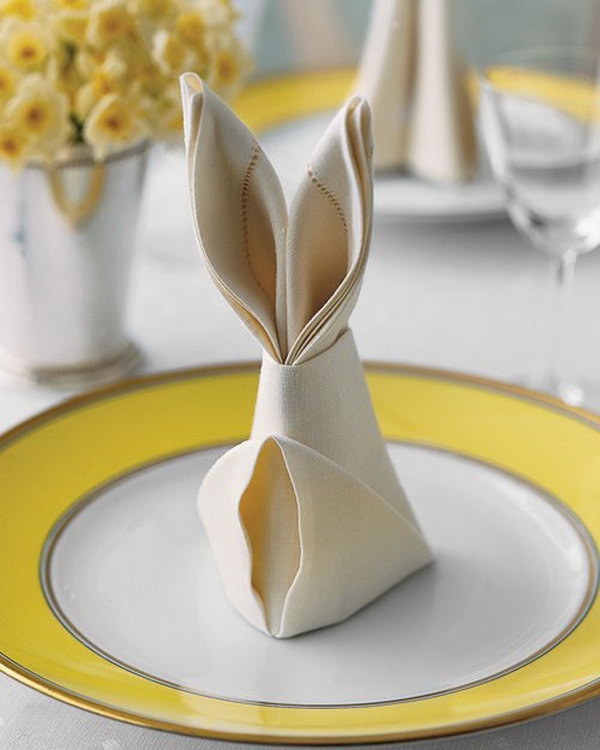 Bunny Fold for Napkins. These Easter rabbit shaped napkins are an easy way to dress up napkins on your Easter table which only require a few simple folds. 