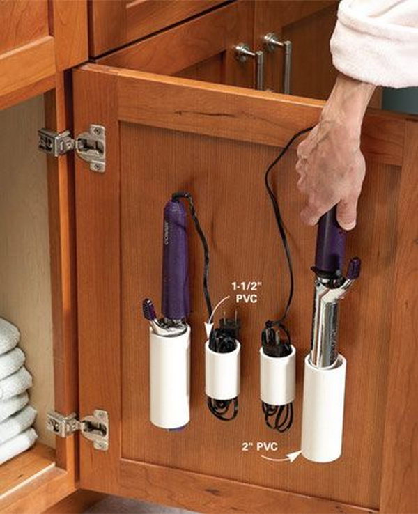 PVC pipe storage for curling irons and cords. Use the space over the vanity cabinet door for storage. Avoid the messy look of curling irons lying on the vanity or the toilet tank. 