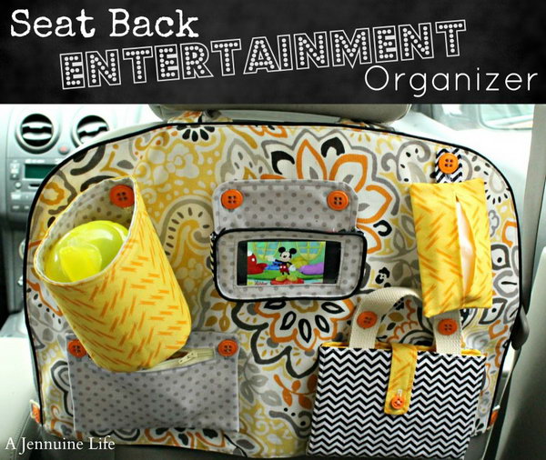 Seat Back Entertainment Organizer. This beautiful and cool seat back entertainment organizer is handmade with a drink holder, phone holster, tissue bag, zipper pouch, coloring folio. It is easy to make one for a good user of the sew machine. 