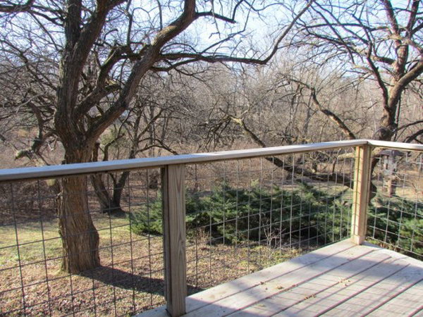  Wire lattice deck railing. This striking yet inexpensive wire lattice deck railing idea is really creative. Using wire instead of wood is a budget friendly option and it's also very strong. And the wire offers unobstructed views of the beautiful yard. What's very important to the homeowners is the squares of wire are more safely to their lovely granddaughter. 