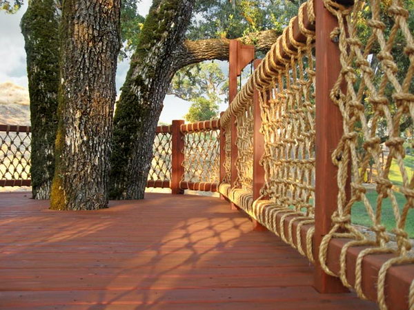 Rope net deck railing. Very creative way to use rope as deck baluster. And the rustic wood and rope deck railing provides great views. Really great idea. 