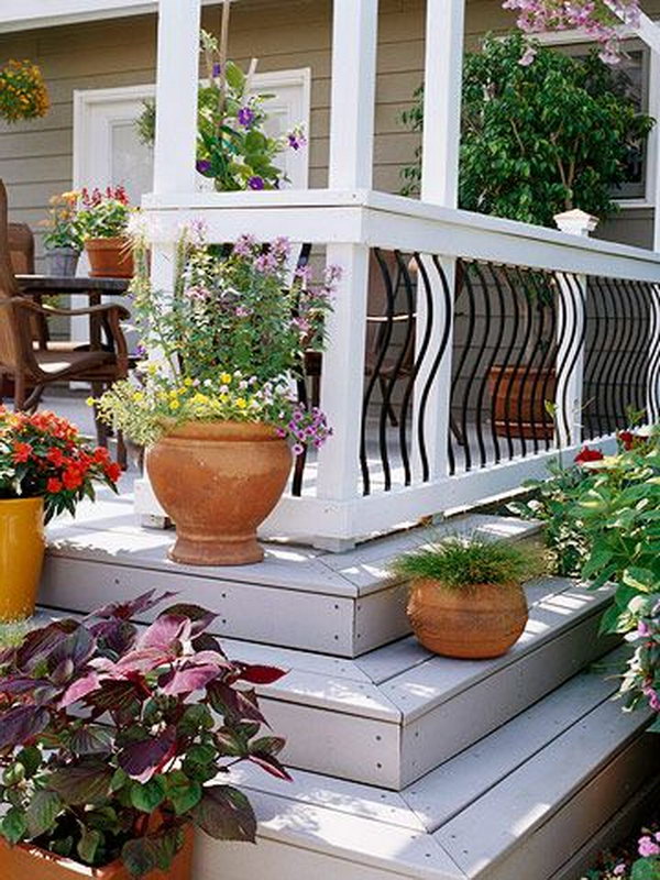  Curvy and beautiful.  Curvaceous aluminum balusters give a lift to this sharp black-and-white color scheme railing. The railing were done beautifully and eliminates the confined feeling that bulky wood balusters can create. 