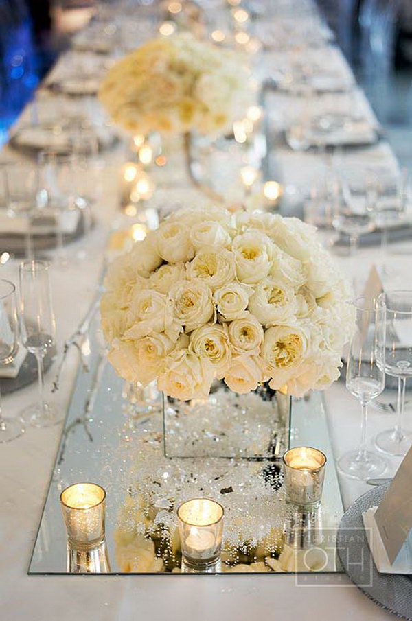 Mirror Centerpieces Decorations. Using mirror elements in your wedding or any other party is so modern and unique. These wedding centerpieces using mirrors add more elegance to the wedding. 