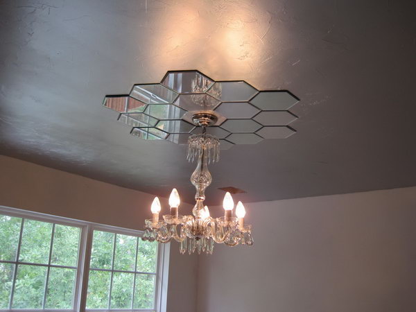 Mirrored Ceiling Medallion. This mirrored ceiling medallion looks so harmonious with the whole style of the bedroom, plus adds more elegance. With little imagination, you can make one by yourself for about $30 out of candle plates from Hobby Lobby. 