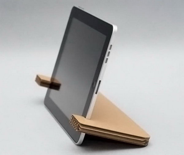 DIY Cardboard iPad Stand. We have so many cardboard boxes. Everything we buy comes in a cardboard box. Next time,do not throw away them after you open a package, you can get a new iPad stand just by using a scissor to make some cuts and clips to the cardboard box . 