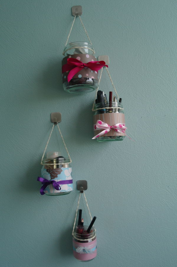 Makeup Organizer Hanging Jars .Decorate the common jars with beautiful fabric or colored ribbons, then hang them up with a good amount of strings. New hanging makeup kits born out .So simple but incredible cute. 