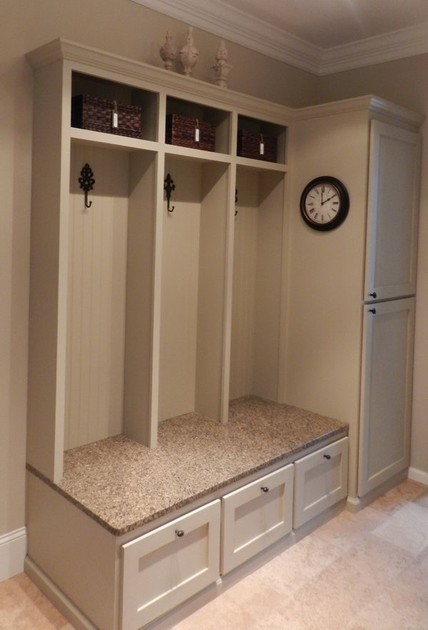 Functional cabinet. A little bench provide convenience when you put on or take off your shoes. A few hooks for hunging up the purses and jackets. Brown baskets above for scarves and gloves, leashes and miscellaneous paraphernalia. 