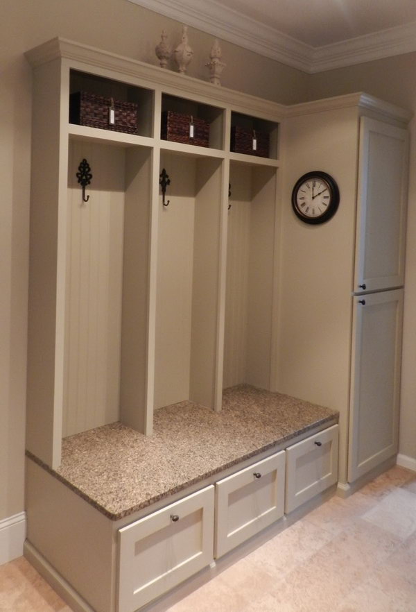  Functional cabinet. A little bench provide convenience when you put on or take off your shoes. A few hooks for hunging up the purses and jackets. Brown baskets above for scarves and gloves, leashes and miscellaneous paraphernalia.