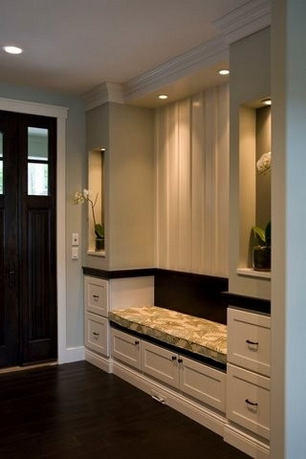 Elegant mudroom. Symmetry is utilized everywhere in interior designing and it can create a space easy to eyes. And the contrast between black and white is also very classic and beatiful that is keeping hot. This mudroom is a perfect example. Especially appreciate the recessed lighting which adds sophistication to the spaces as well as warming it up. 