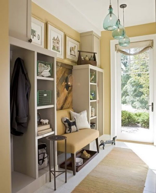  Neutral color mudroom. This yellow mudroom is too pretty to be a 'mud room'. The layout of color is perfect and gives the space a warm and cozy look. All the details are inspiring. And it has great storage space.