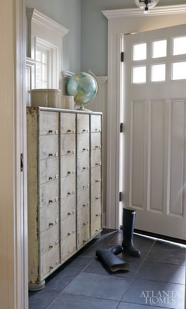 Old boutique cabinet. This mudroom is perfect for each house coastal entryway, love the layout of somthing old and something new. It's a incredible bright spot to make this blue and white space stand out....Love the storage possibilities!! 