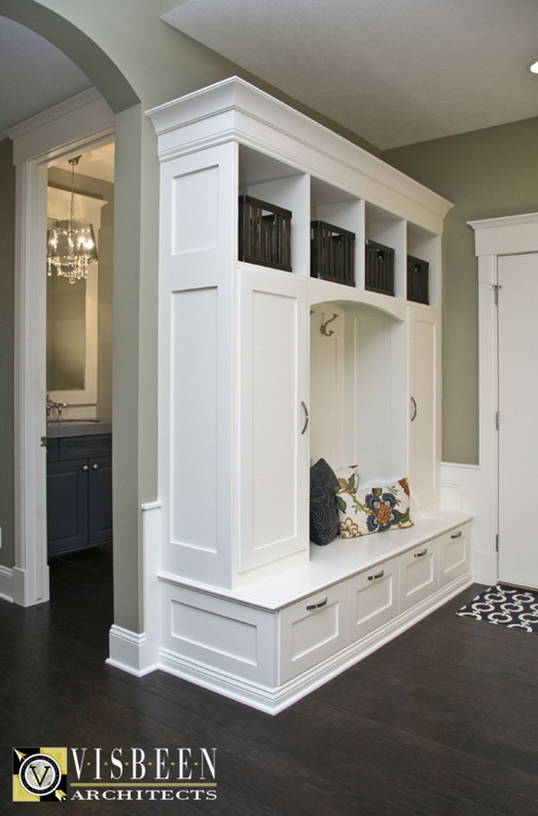 Love this mudroom area! This mudroom behind the front door with built ins to put your shoes and other stuff in is really worthy to have. Also love the color palette. 