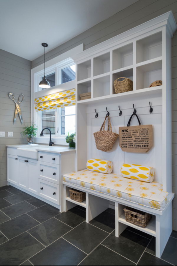  Fresh look. This charming mudroom is done to perfection!  Lovely yellow cloth decor infuses fresh feeling to this white and green mudroom. Especially love the sink, which can keep the mud out from dirtying up the rest of the house.