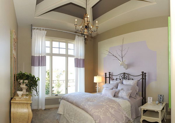 Create an Illusion: In a bedroom without large floor to ceiling windows, here's an example of how you can introduce your favorite purple in and make the space visually spread. I love the way nature touches the room in modern, and the whimsical ways with the lamp, and the deer head. 