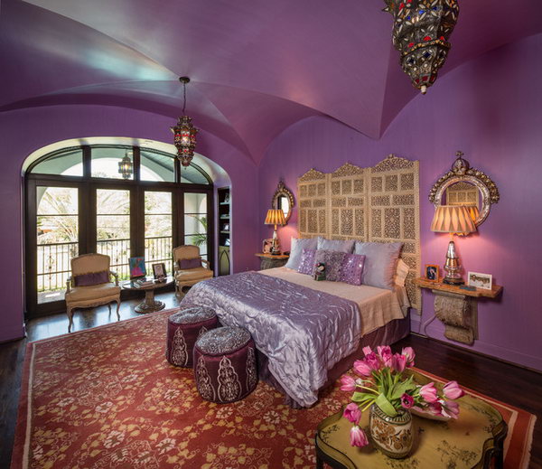 Regal Master Bedroom: Incredible groin ceiling! In this sleeping area, the dark and rustic flooring with red carpet  and the neutral tones of the luxury French furniture contrast with the bold pulple on the wall and the ceiling. Reds and purples paired with gold furniture adds warmth and sophistication to this bedroom 