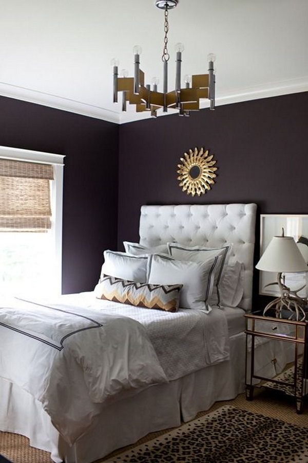 Deep purple wall: The deep color speaks volumes in this simple, yet elegantly styled room! 