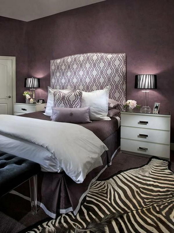 Headboard and Zebra Rug Accents: This bedroom oozes glamour with its mix of purple hues and the beautiful headboard and the eye catching zebra rug. 