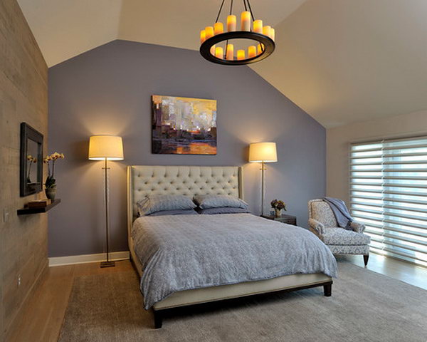 Benjamin Moore 2118 40 'Sea Life':Purple as an accent wall behind bed... adds drama to the tufted linen headboard and original art. Tall glass lamps complement the headboard and ceiling height. Candle chandelier adds ambiance. 