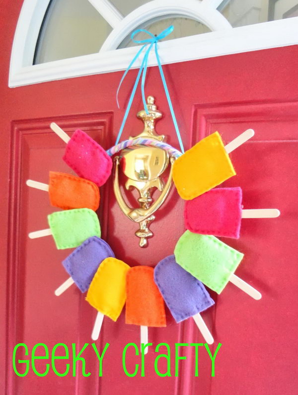 Summery Popsicle Wreath. Popsicles are the symbol of summer. It is so cool to take this idea to make such a summer wreath. 