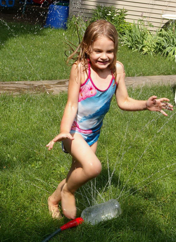 Water fun sprinkler. Simply attach the recycled large bottle with drilled holes all over to the garden hose and then the kids can enjoy great fun in summer to run and jump on it. 