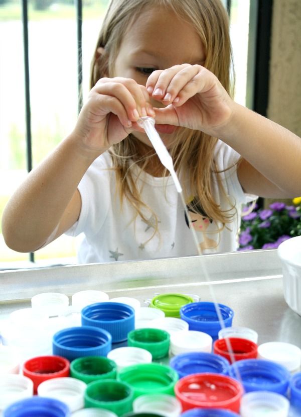 Bottle cap fine motor play   Promote fine motor skills and beginning measurement with this easy prep water play activity. Great game for toddlers and preschoolers. 