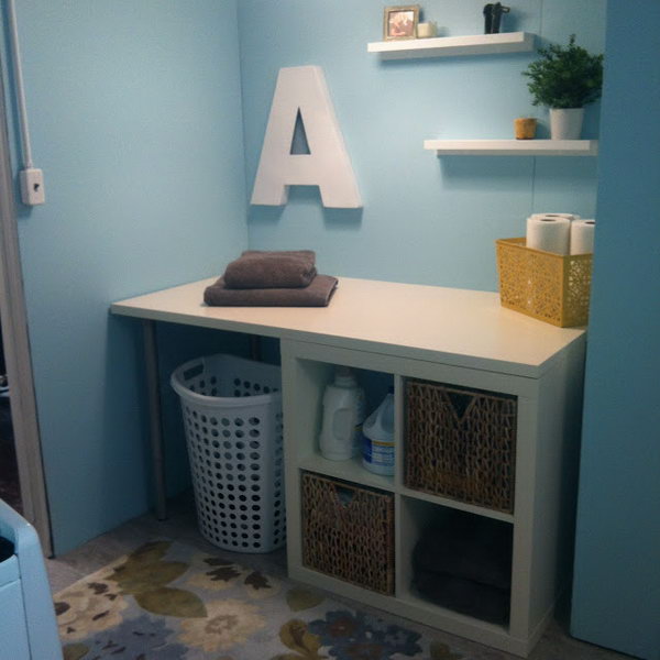 Laundry Folding Area. This clean white Kallax shelf from IKEA makes the perfect place for folding laundry, plus some organized storage. You don't need to spare a special area for it. See the full directions 