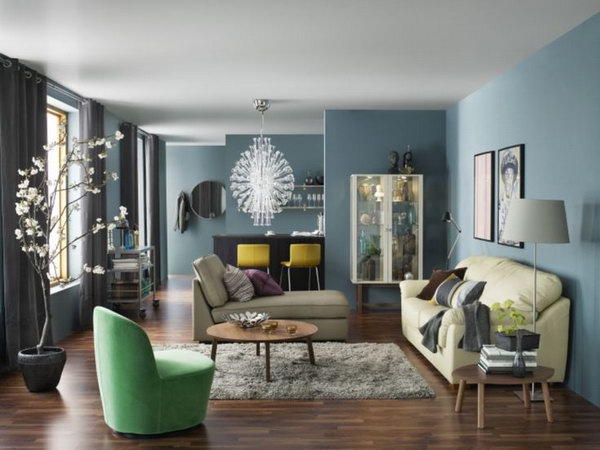 Blue is a popular color during the summer time. The blue painted walls make a sophisticated and chic living room. Every wall can be a stunning display place in your living space. 