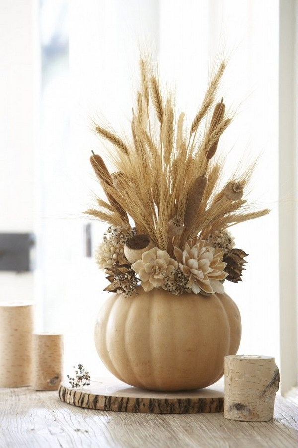 Fall Harvest Arrangement. Use faux pumpkins to create stunning centerpiece arrangements. 