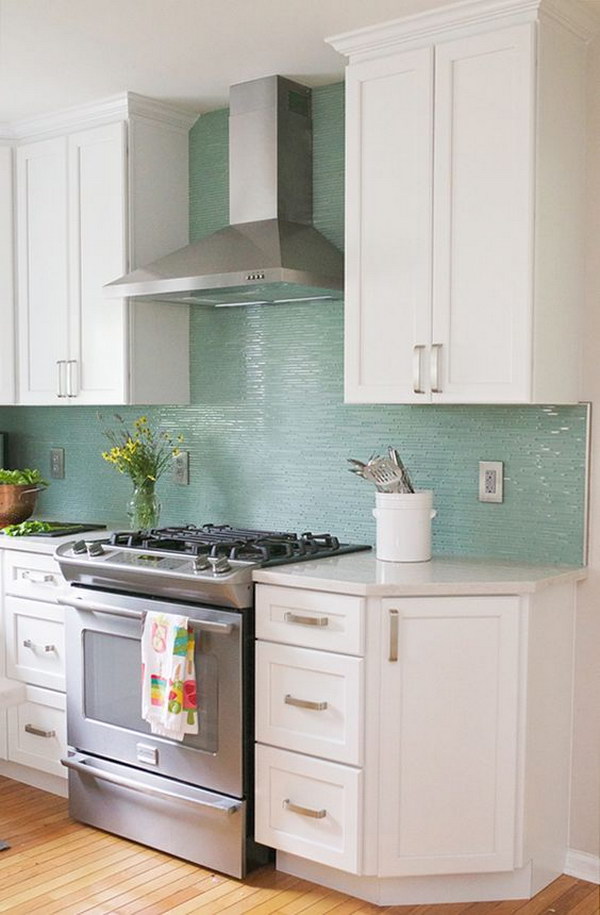 Snow White Cabinets Paired with Turquoise Backsplash. 