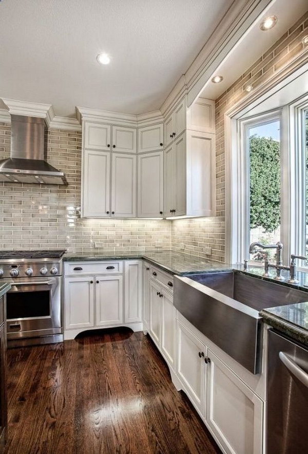 Off-White Kitchen Cabinets with Brick Backsplash. 