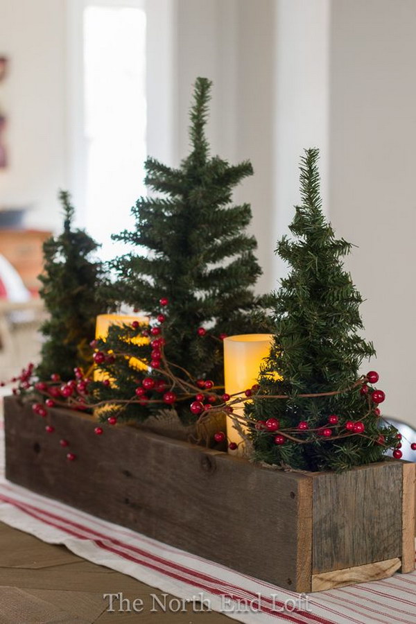Small Faux Christmas Trees And Pillar Battery Candles Wrapped With Red Grapevine Berries In A Rustic Wooden Box. 