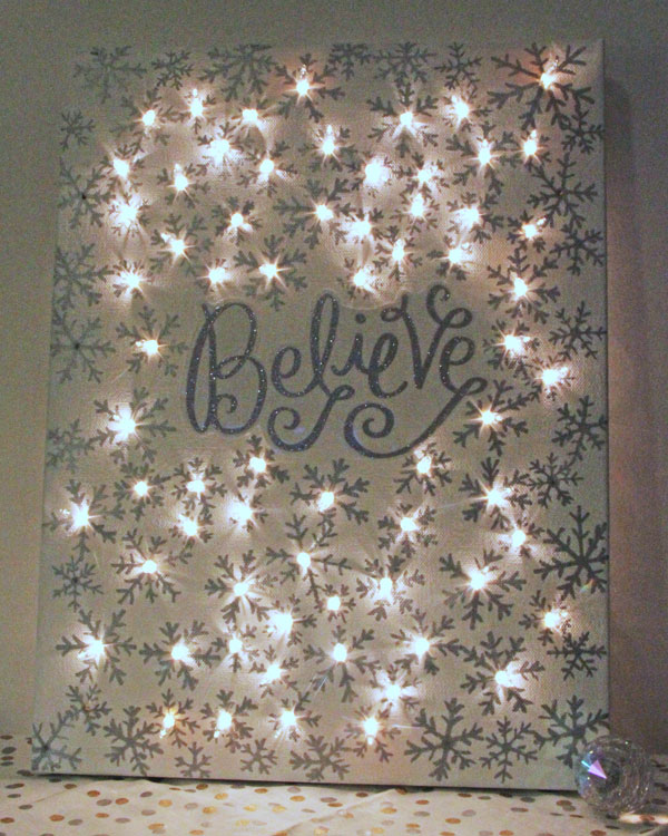 DIY Illuminated Canvas using  Sharpies and String Lights . 